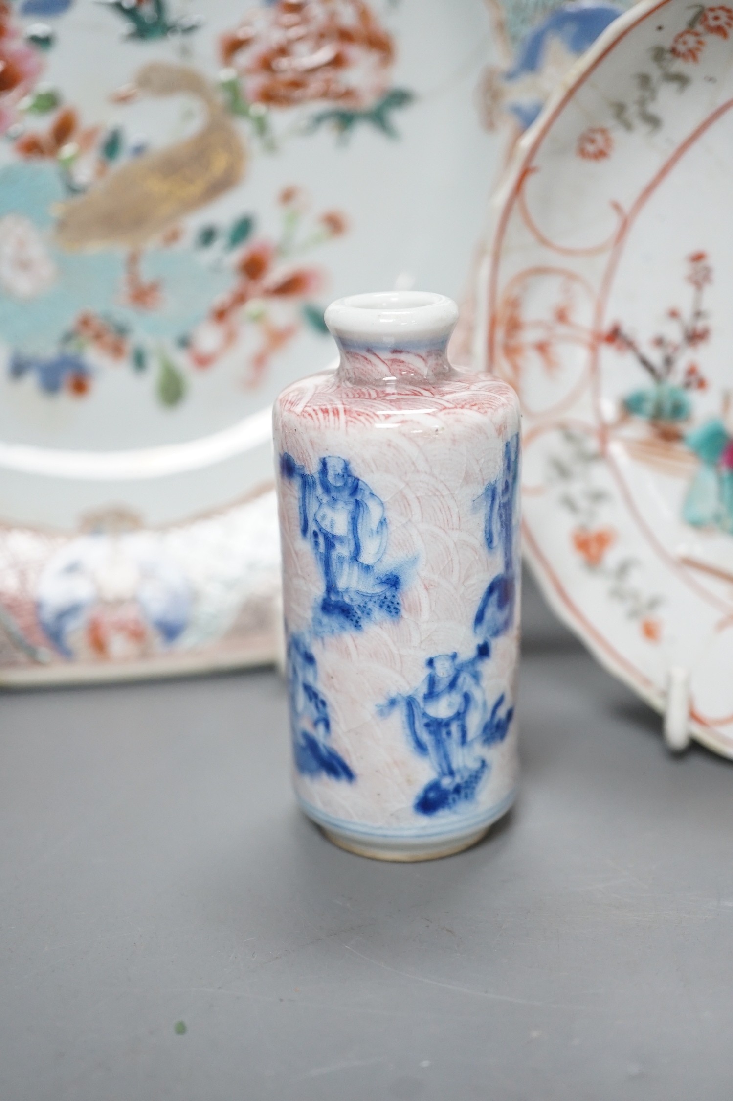 An 18th century Chinese export octagonal dish, a similar saucer and an underglaze blue and red snuff bottle